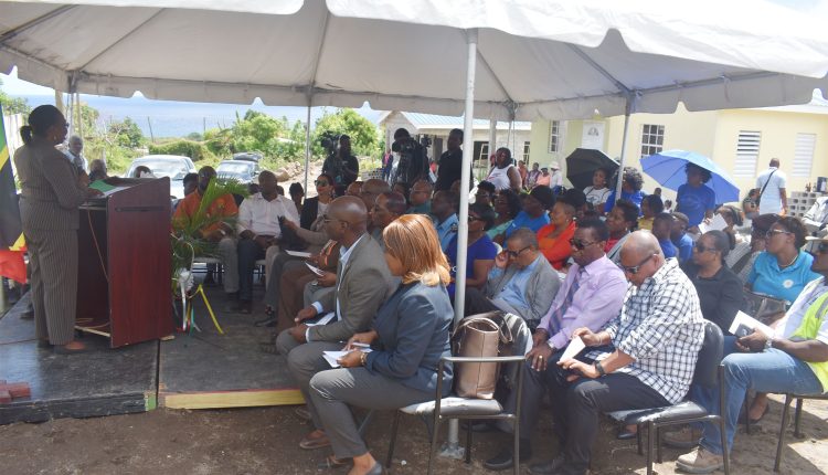 Acting Director of the Department of Social and Community Development, Mrs Mary Anne Wigley, addressing the house handing over ceremony at Stone Castle in Tabernacle.