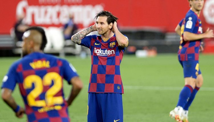 Barcelona’s Argentinian forward Lionel Messi (C) reacts after missing a goal opportunity during the La Liga match against Sevilla in Seville, Spain, June 19, 2020