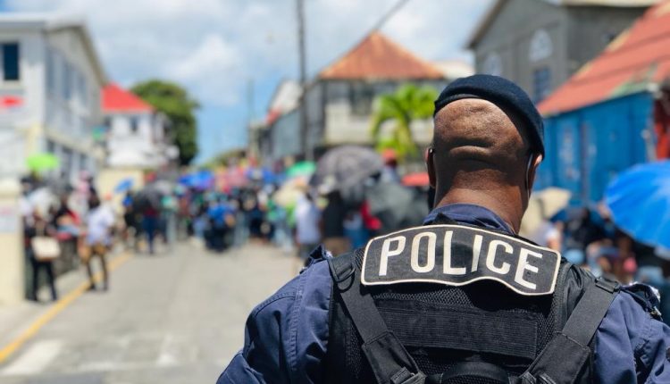 Officers trying to control the chaos at Wesleyan Holiness polling station in Constituency #2