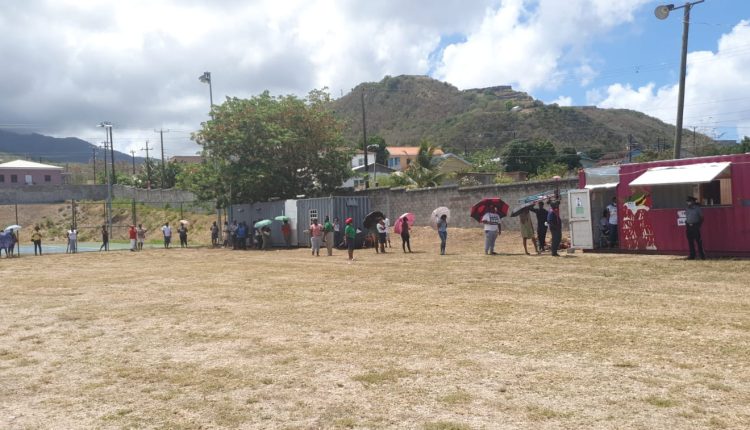 Voters line up to vote in Constituency #5