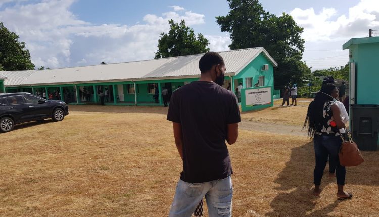 Voters respecting social distancing as they cast their ballots in Lodge