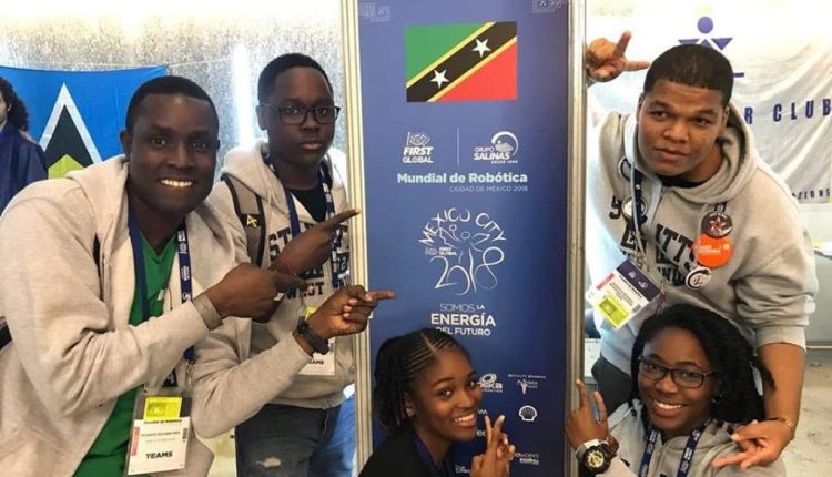 Dr. Neil (left) with some members of the St. Kitts-Nevis Robotics Team in Mexico in 2018