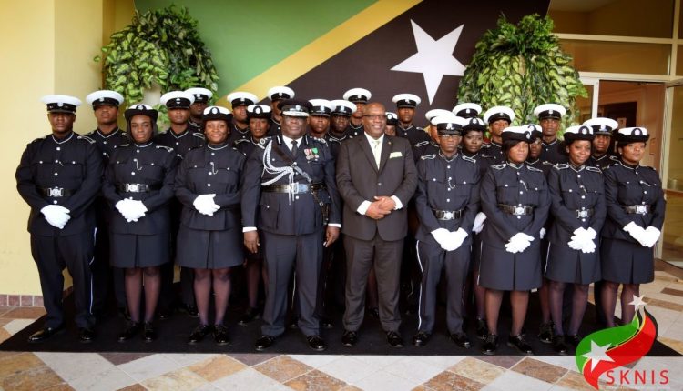 Prime Minister and Minister of National Security, Dr. the Hon. Timothy Harris, as well as Commissioner of Police, Mr. Hilroy Brandy pictured with the 25 graduates of Course No.44.