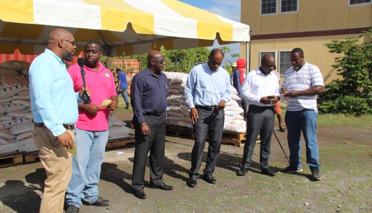Mr. Huey Sargeant, Permanent Secretary in the Ministry of Agriculture; Mr. Kelso Clark, Livestock Extension Officer; Hon. Alexis Jeffers, Deputy Premier of Nevis and Minister of Agriculture; Mr. Colin Dore, Permanent Secretary in the Ministry of Finance; Mr. Randy Elliott, Director of Agriculture; and Mr. Floyd Liburd, Deputy Director of Agriculture at the handing over ceremony at Prospect,  for distribution of free feed to livestock owners as part of a Nevis Island Administration/Eastern Caribbean Group of Companies partnership on July 15, 2020