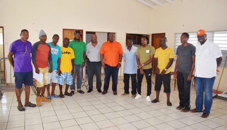 Sponsor of Number 7 Domino League, Prime Minister Dr the Hon Timothy Harris (6th right) with domino officials and captains of teams taking part in the Invitation Domino tournament.