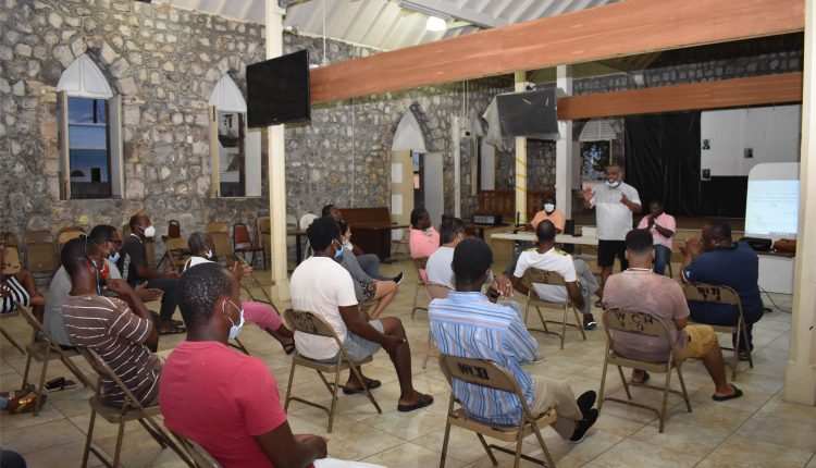 Ambassador His Excellency Ian Patches Liburd addressing members of the East Basseterre PLP Constituency Number One Group at the Old Boys’ School in Basseterre.
