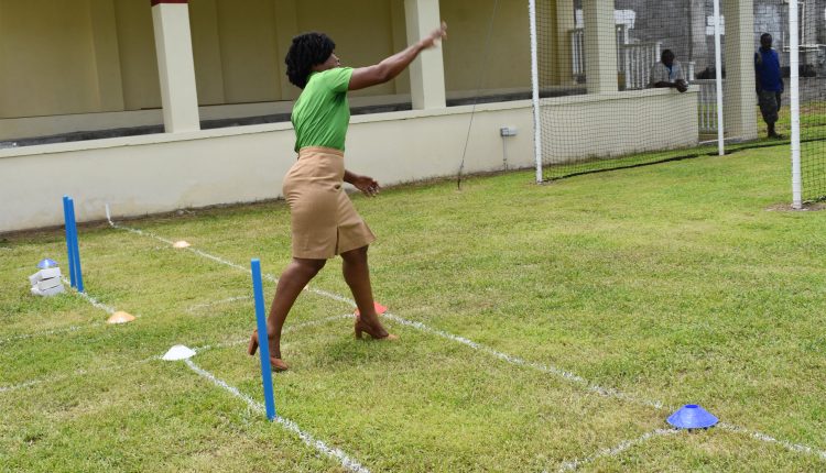 Ms Hyacinth Pemberton bowling at the practice nets of the newly opened Livingstone Sargeant Cricket Practice Facility.
