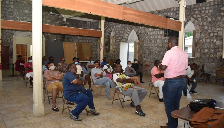 PLP Deputy National Chairman Mr Craig Tuckett addressing members of the East Basseterre PLP Constituency Number One Group at the Old Boys’ School in Basseterre.