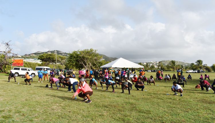 Participants of the SKN Moves Health Walk engaged in ‘cool-down’ exercises at the end of the gruelling walk.