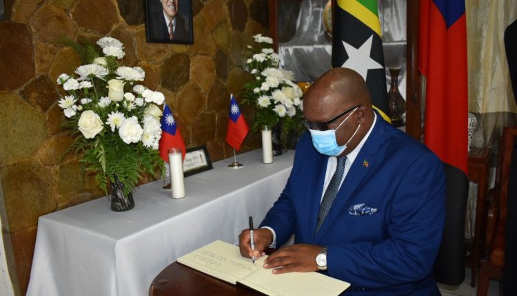 Prime Minister Dr. the Hon. Timothy Harris signing the book of condolence for the late Lee Teng-hui, former President of Taiwan.