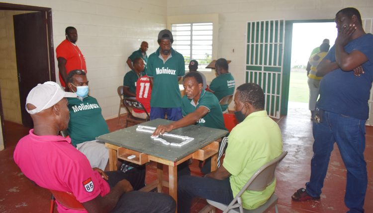Roger Crawford of Mansion Domino Club in action as his team raced to beat Sylvers Domino Club 13-7 at the Lodge Community Centre in Lodge Project.