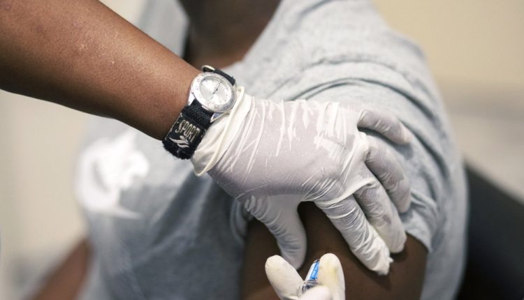 Sisi Ndebele, receives a seasonal influenza vaccine from a nurse at a local pharmacy clinic in Johannesburg, South Africa on Friday, April 24, 2020. Ordinarily, South Africa sees widespread influenza during the winter months, but this year almost none have been found — something unprecedented. School closures, limited public gatherings and calls to wear masks and wash hands have “knocked down the flu,” said Dr. Cheryl Cohen, head of the institute’s respiratory program.