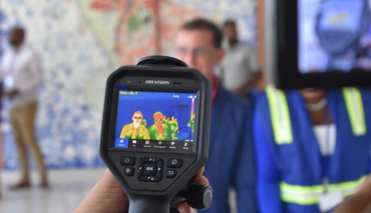 An individual demonstrates the use of the HIK Vision Temperature Screening Thermographic handheld Camera