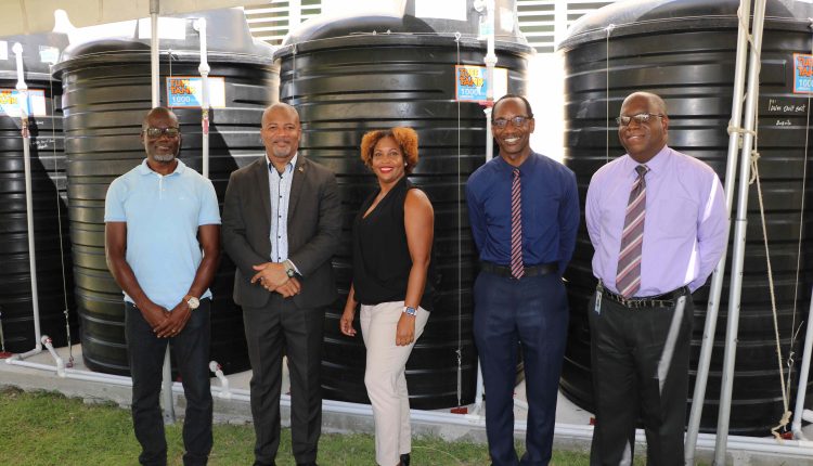 (l-r) Denison Paul of WaterWorks Solutions; Hon. Spencer Brand, Minister of Environment and Water Services in the Nevis Island Administration; Ms. Sharon Rattan, Permanent Secretary in the Ministry of Environment (St. Kitts); Kevin Barrett, Permanent Secretary in the Ministry of Education in the Nevis Island Administration; Juan Williams, Principal of Charlestown Secondary School at a ceremony to commission a water storage system at the Charlestown Secondary School on October 20, 2020