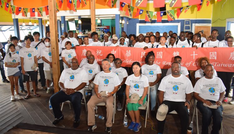 Group picture at Ocean’s Bar in Frigate Bay: Front row (sitting) from left are: Prime Minister Dr the Hon Timothy Harris, Ambassador H.E. Tom Lee, and Mrs Lee, Premier of Nevis the Hon Mark Brantley, and Minister of Environment the Hon Eric Evelyn.