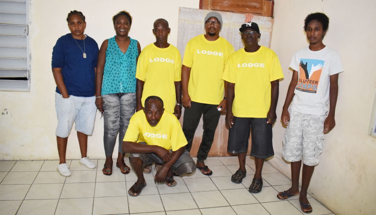 Lodge Domino Club, third position winner in 25th edition of Constituency Number Seven Dr the Hon Timothy Harris Domino League pictured with game officials at the Lodge Community Centre in Lodge Project.