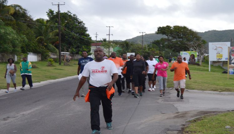 Prime Minister Dr the Hon Timothy Harris (wearing SKN Moves shirt), seen walking alongside Ambassador His Excellency Ian Patches Liburd on the walk held on Saturday September 26 this year.