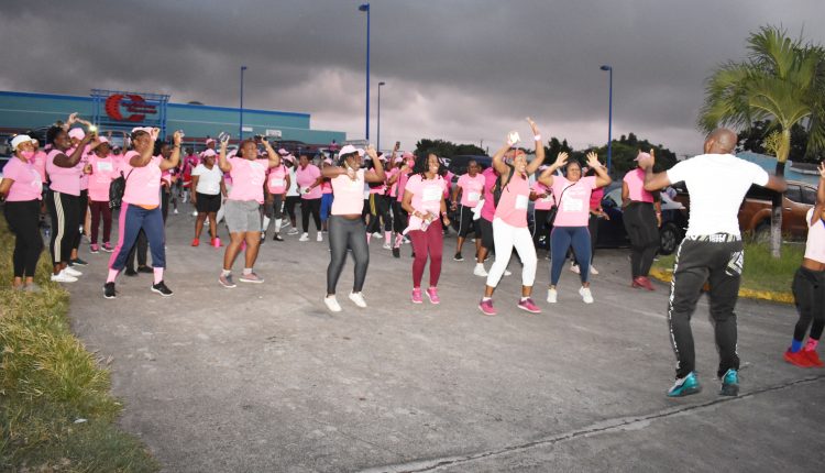 Before the walk started, participants were led through warm-up exercises on the parking lots of Caribbean Cinemas by fitness guru Mr Elston Nisbett.