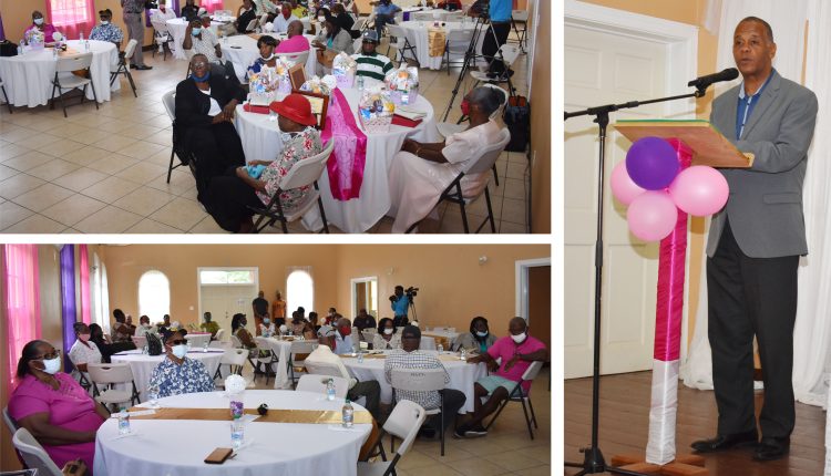 Minister of Social Development in the Nevis Island Administration (NIA) the Hon Eric Evelyn (right) delivering remarks at the Senior Citizens Division Awards Ceremony and Luncheon at the Jessup’s Community Centre.