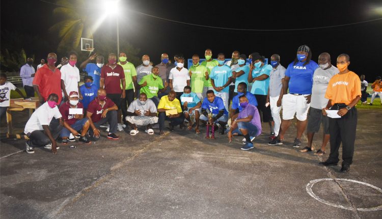 Domino players from the different teams posed for a picture with league sponsor, Prime Minister Dr the Hon Timothy Harris.