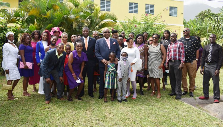 Prime Minister, Dr the Hon Timothy Harris, pictured outside the Holy Family Catholic Church in Molineux with members of Constituency Number Seven Group who had accompanied him.