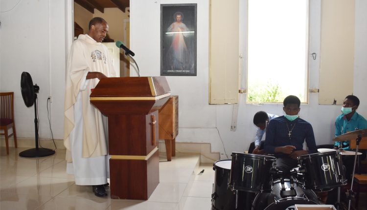 Father Lawrence Malama delivering sermon on the celebration of the Feast of All Saints.