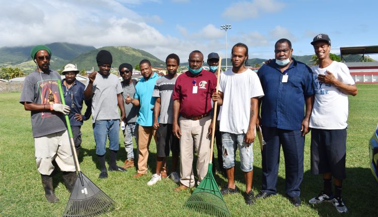 Mr Emile Greene (2nd right) with members of the New Town STEP Community Enhancement Group. On the right is the supervisor, Mr Kennedy Charles.