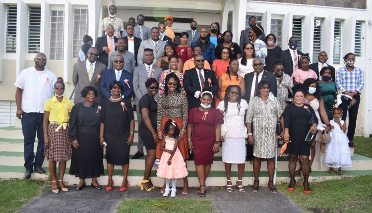 Prime Minister Dr the Hon Timothy Harris is joined by Cabinet colleagues Hon Shawn Richards, Hon Akilah Byron-Nisbett, and Hon Byron Nisbett for a group picture with a subset of some of the supporters who had joined him for the service.