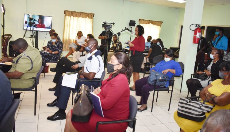 Journalist/news anchor, Ms Karla Berridge (standing), of ZIZ Broadcasting Corporation thanking Prime Minister Harris before she posed her questions.