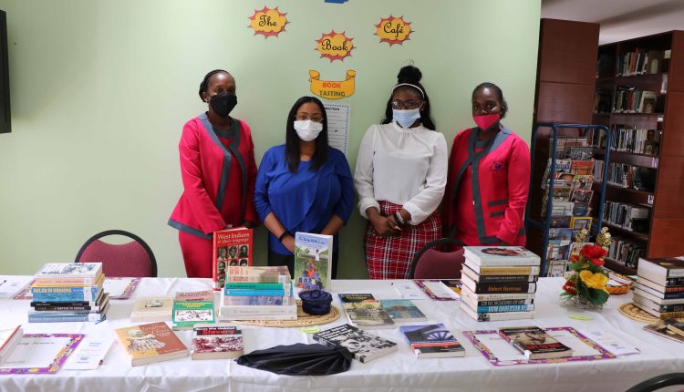 Mrs. Anastasia Parris-Morton, Chief Librarian at the Nevis Public Library with staff members Ms. Tisha Brookes, Ms. Natalya Roberts and Ms. Janell Prentis with some of the books available for selection for a “Book Tasting” from February 15 to 20, 2021 for Black History Month at the Nevis Public Library on Market Street in Charlestown