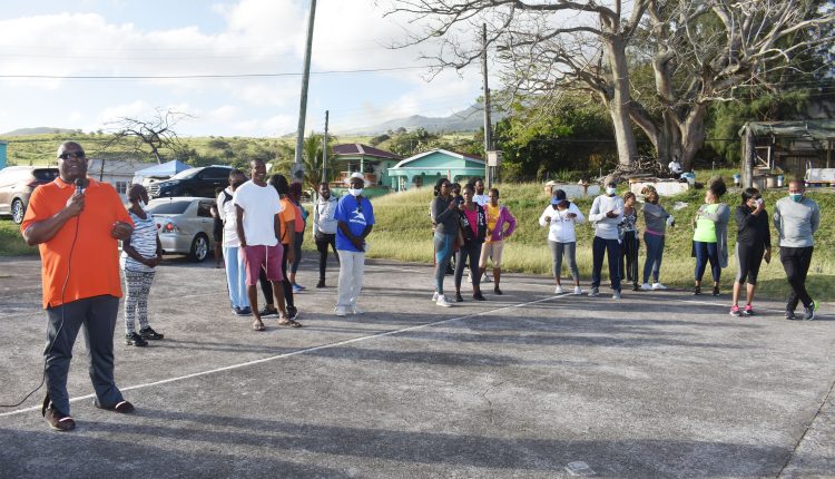 Prime Minister Dr the Hon Timothy Harris addressing walk participants and members of the general public at the Ottley’s hardcourts.