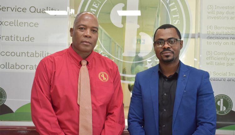 Development Bank of St. Kitts and Nevis Chief Executive Officer, Mr Lenworth Harris (left), with Dr Mathias Afortu-Ofre.