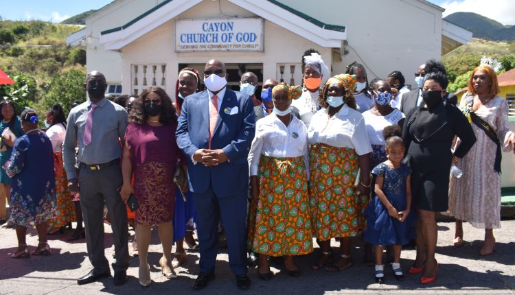 Prime Minister Dr the Hon Timothy Harris and a subset of members of Constituency Number Seven Group pose for a group picture after the morning worship service at the Cayon Church of God.
