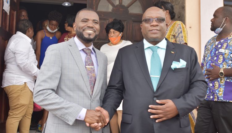 Prime Minister Dr the Hon Timothy Harris (right) with Pastor Steve Huggins after the worship service.