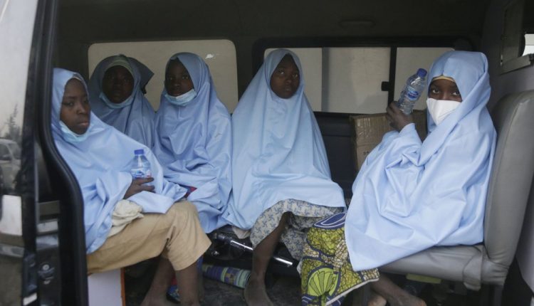 Some of the students who were abducted by gunmen from the Government Girls Secondary School, in Jangebe, last week wait for a medical checkup after their release meeting with the state Governor Bello Matawalle, in Gusau, northern Nigeria, Tuesday, March 2, 2021. Zamfara state governor Bello Matawalle announced that 279 girls who were abducted last week from a boarding school in the northwestern Zamfara state have been released Tuesday.(AP Photo/Sunday Alamba)