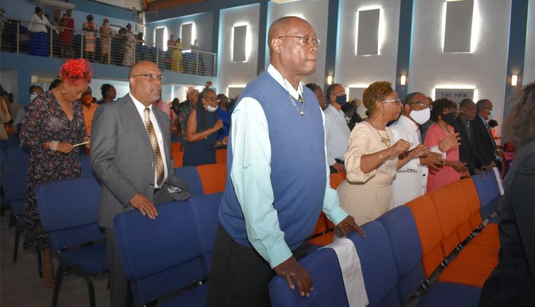 General Manager Mr Viere Galloway (nearest the camera) with Announcer Mrs Jasmine ‘Jazzy-D’ Thomas to his left, and Sales and Marketing Manager Mr Grell Browne in the row behind during the anniversary worship service.