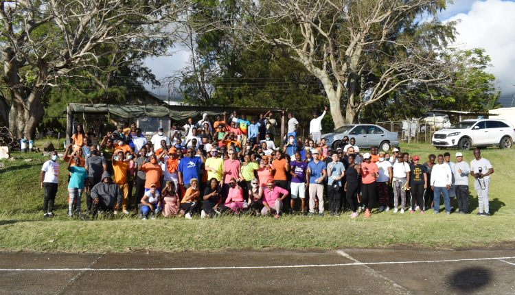 We made it: After walking all the way from Bellevue, these health conscious walk enthusiasts join Prime Minister Dr the Hon Timothy Harris for a group picture at the Ottley’s hardcourts.