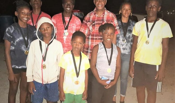 Hon. Eric Evelyn with youths at the Jerry and Ursulla Fyfield Memorial Camp at New River, Nevis on April 04, 2021