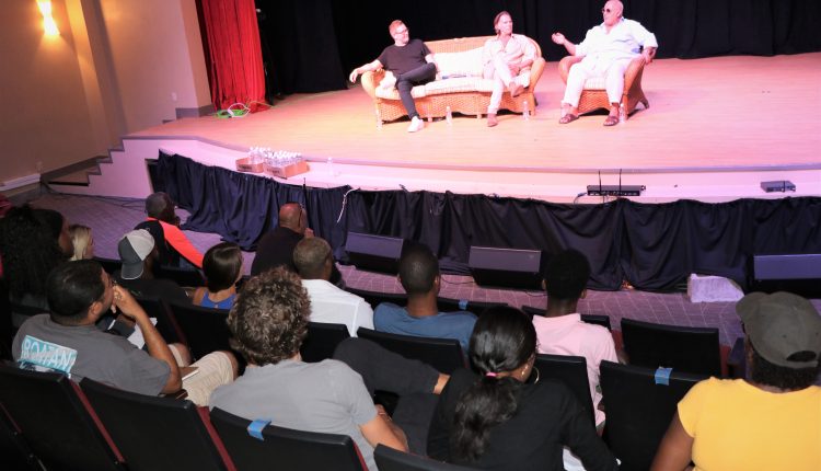 Acting students interact with (l-r) Mr. Tom Peyton, director; Jeff Fahey, actor; and Philippe Martinez, producer, at the Nevis Performing Arts Centre on March 29, 2021