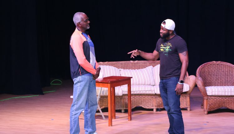 Mr. Winston Crooke (l) with acting student during an audition at the Nevis Performing Arts Centre on March 29, 2021