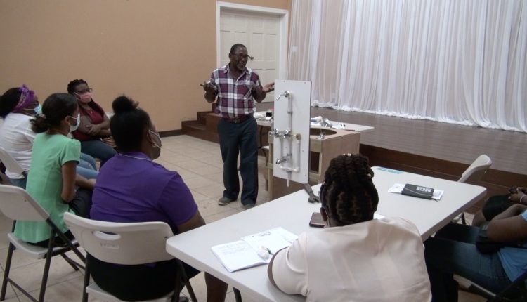 Participants at the Department of Gender Affairs’ Plumbing Workshop for Women at the Jessups Community Centre with facilitator Mr. Thomas Dore on March 30, 2021